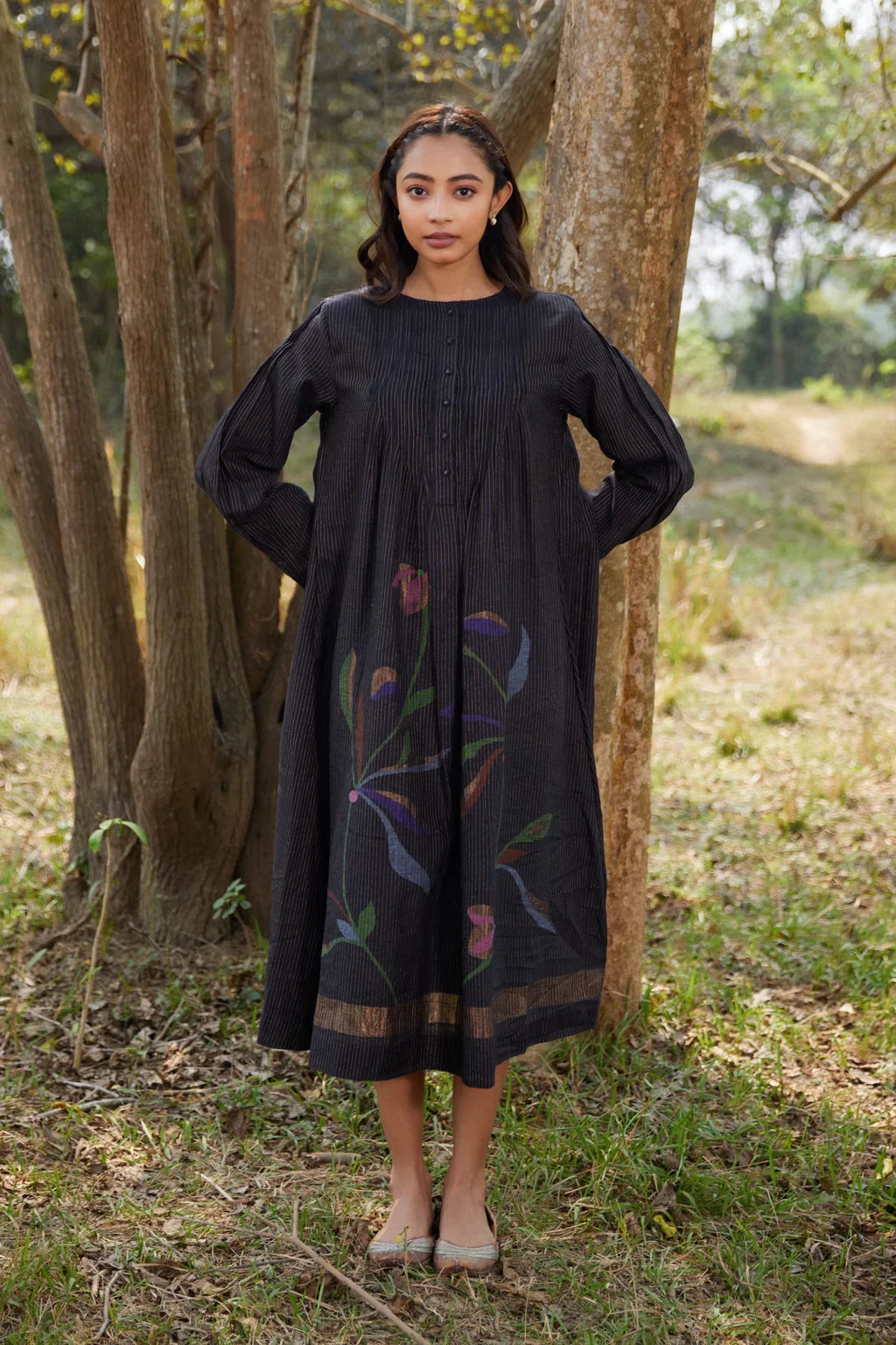 Sarron Sumi Dress, black silk-cotton Jamdani dress with golden stripes and scattered floral motifs.