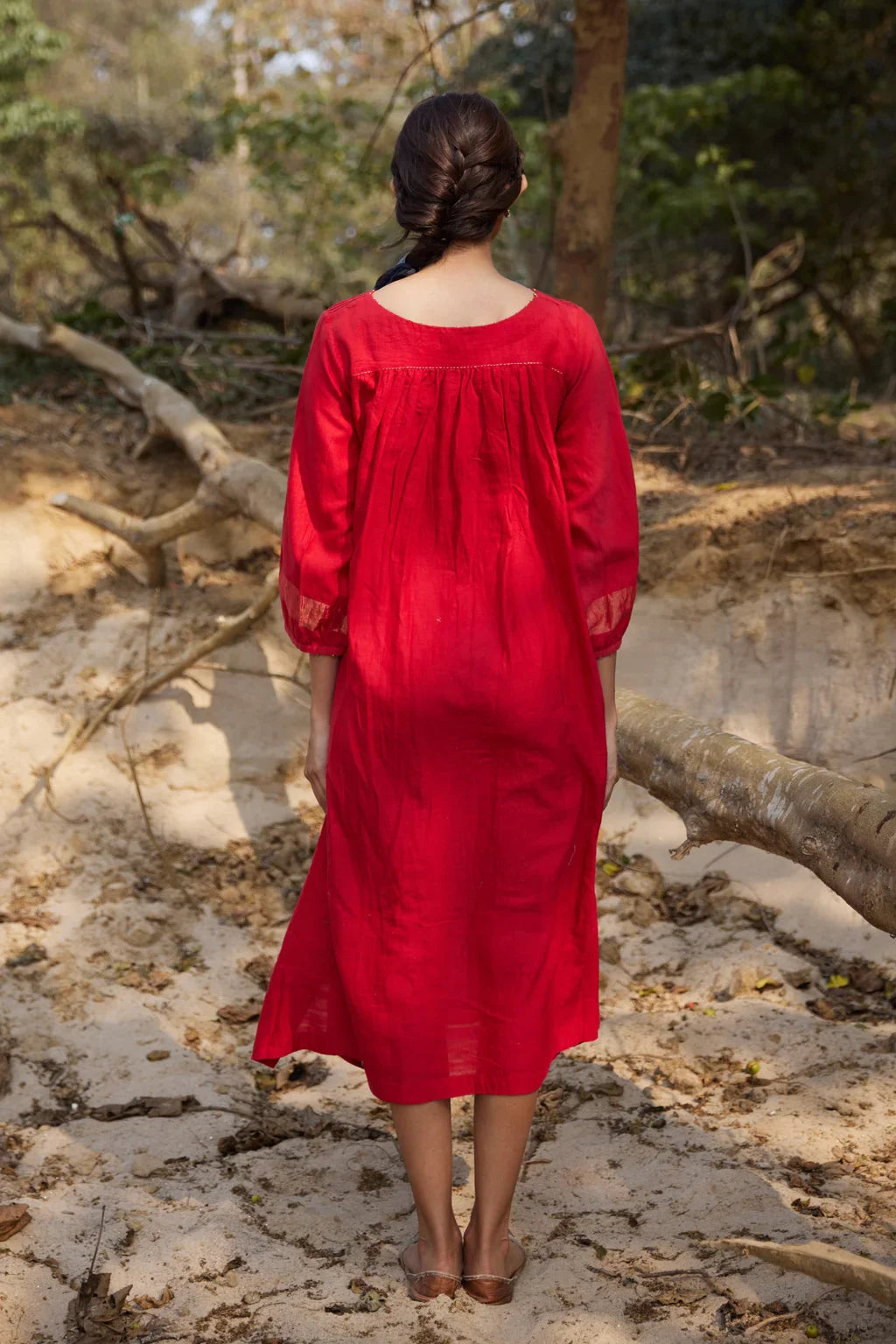 Sarron Susmita Dress, red silk-cotton Jamdani dress with a handwoven flamingo motif and a flared hem.