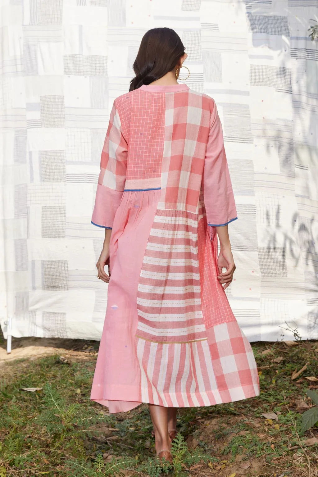 Sarron Tarini Dress, pink cotton Jamdani dress with stripes, checks and handwoven Jamdani motifs.