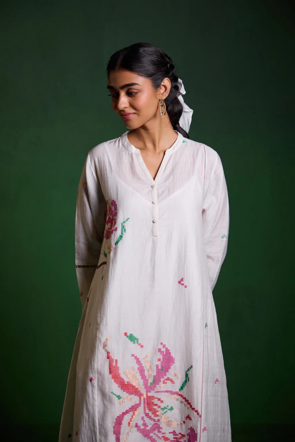Sarron Uma Dress, white silk-cotton Jamdani dress with large floral graph motifs and a split neckline.