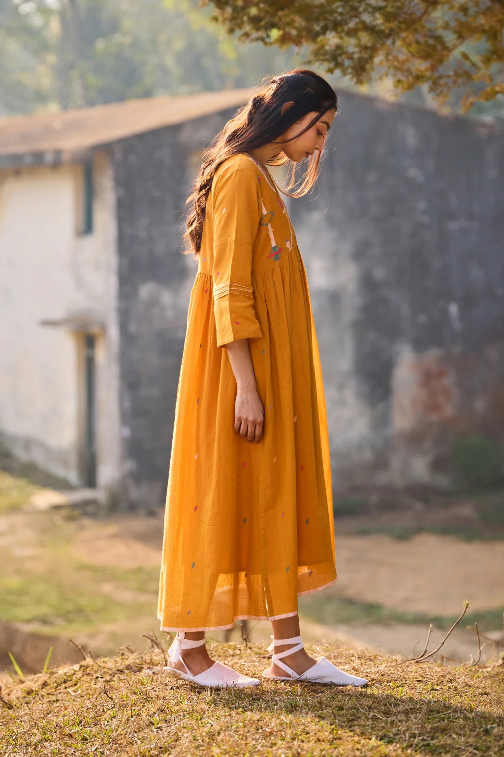 Sarron Ushnota Dress, mustard yellow cotton Jamdani V-neck dress with a geometric yoke motif and Kantha-worked sleeves.